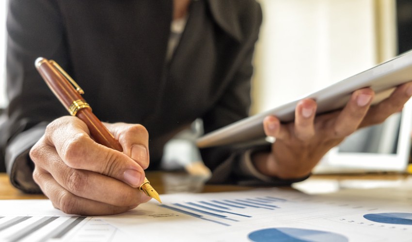 Businesswomen analyzing investment charts 