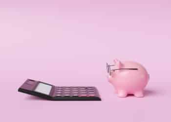 Piggy bank wearing glasses looking at calculator, SMSF pension breaches